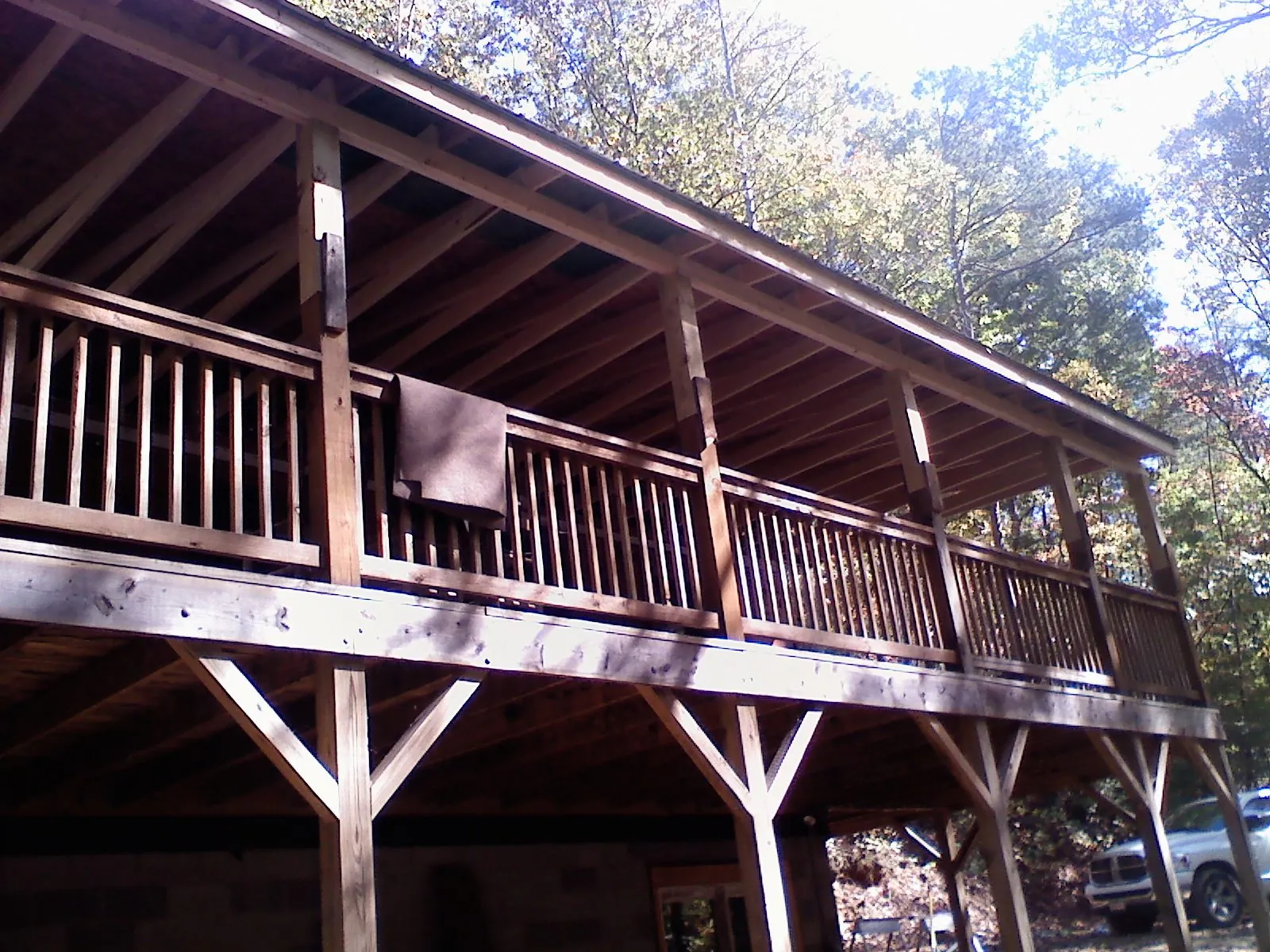 Timber framing under a new elevated porch and deck — Roof Leak Repair in Rocky Point by Roofing Brothers
